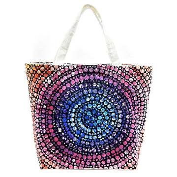 A large tote bag printed with artwork by Olivia Wilson in blue and pink.