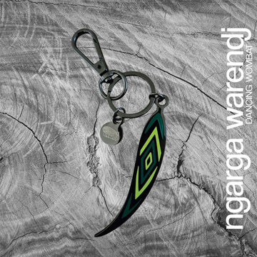 An enamel keyring charm shaped like a gumleaf. 