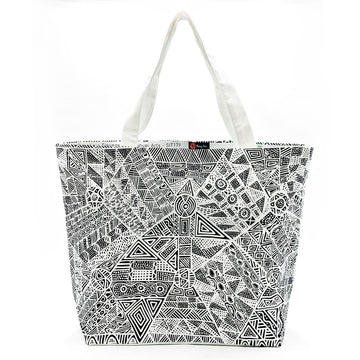 A large tote bag printed with artwork by Simplocoa Tipunwuti in black and white.