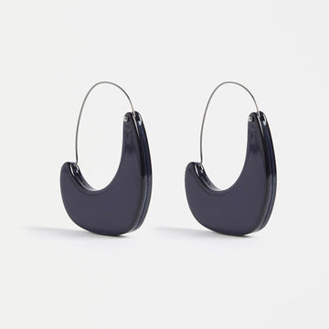 A pair of crescent shaped earrings with a hinged hoop in New Navy colour.