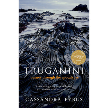 'Truganini' book cover featuring a close up photo of black seaweed with the ocean in the background.