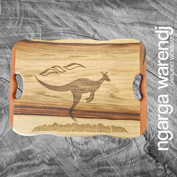 Wooden cutting board with kangaroo engraving on a gray textured background, featuring the brand 'ngarga warendj'.