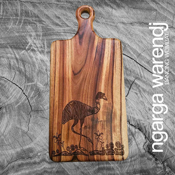 Wooden cutting board with emu design on a gray stone surface, featuring the brand 'ngarga wardenj'.