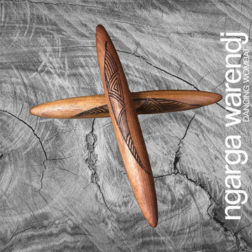 A pair of wooden clapsticks engraved with a design.