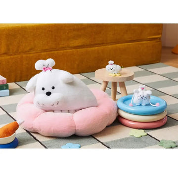 White plush toy with a pink bow on a white background.