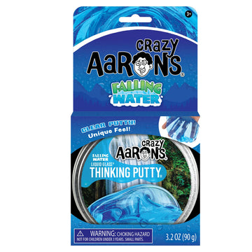 An open card box titled 'Crazy Aarons Falling Water' with a round container of putty inside the box.