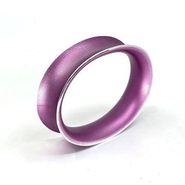A lilac coloured bangle on a white background.