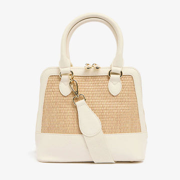 Front view of a handbag with a woven design on the front with a double top zipper and multiple straps.