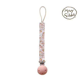 A dummy clip attached to a strap illustrated with gumnut babies by May Gibbs.