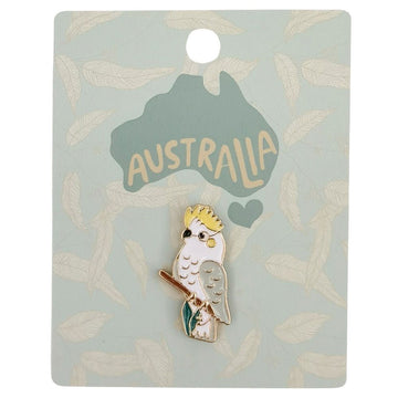 An enamel pin shaped like a cockatoo on a blue card with the heading 'Australia'.