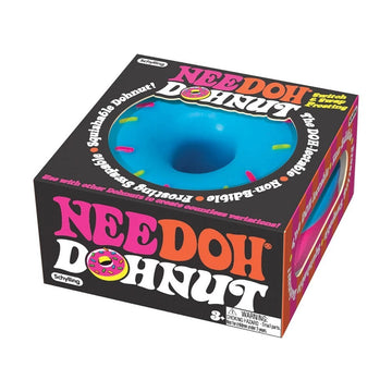 A box with a squish toy inside shaped like a blue donut. The box has the heading 'Nee Doh Dohnut'.