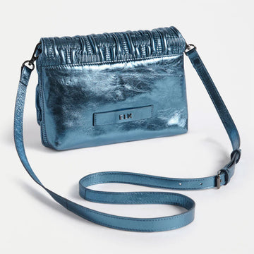 Blue textured handbag on a light gray background.