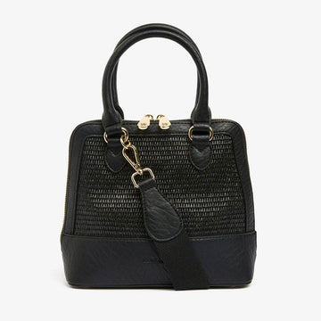 Front view of a handbag in black with a woven design on the front with a double top zipper and multiple straps.