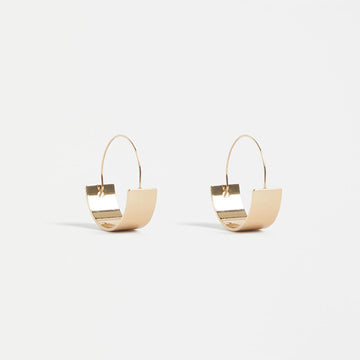 A small hoop earring with a round flat bottom in a Gold finish.