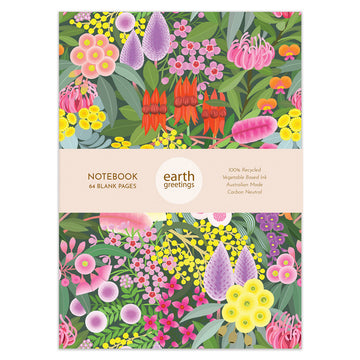 A notebook front cover illustrated with colourful flowers on a green leaf background. There is a product sleeve around the notebook.