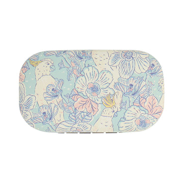A small hard shell container illustrated with cockatoos and flowers.