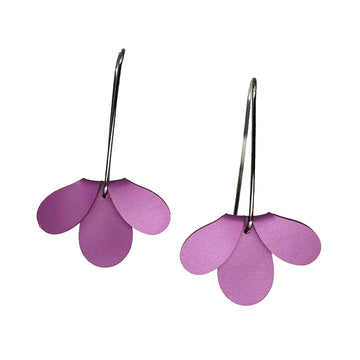 Purple flower-shaped earrings on a white background.