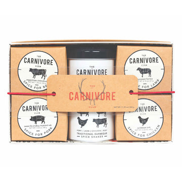 A box with four brown cube boxes and a can in the middle each titled 'The Carnivore Club' with a different description on them.