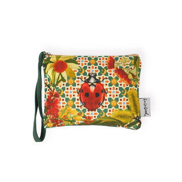 A coin purse with an illustration of a lady bug on the front surrounded by flowers.