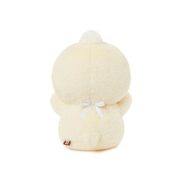 Plush toy resembling a duck in a white outfit on a white background.