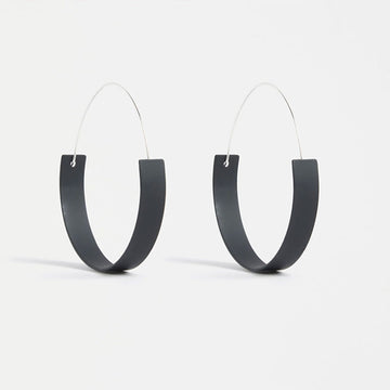 A hoop earring with a flat rounded bottom in Black.