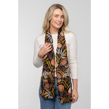 A silk scarf printed with protea flowers in orange and black.