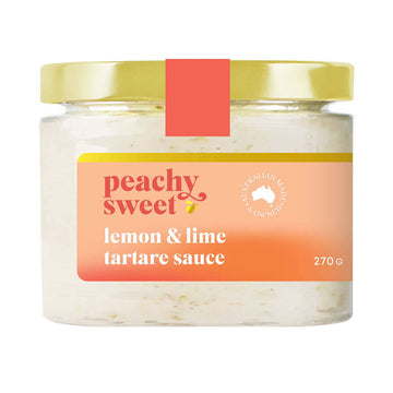 A jar filled with tartare sauce and a product label on the front with the text 'Peachy Sweet Lemon and Lime Tartare Sauce'.
