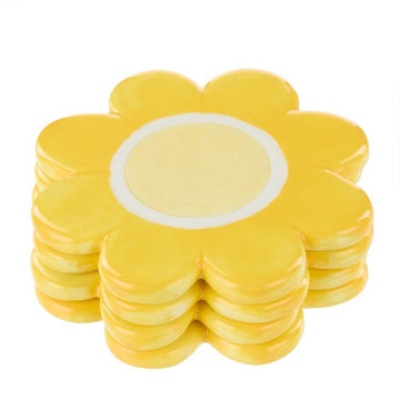 A set of coasters in a flower design in yellow.