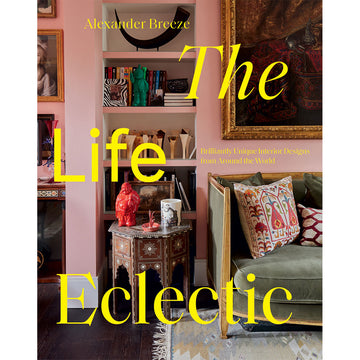 'The Life Eclectic' book cover featuring a photo of a section of a living room with a bookshelf, side table and couch visible.