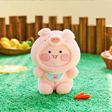 Plush toy of a pink pig character on a white background.