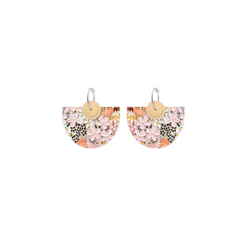 A pair of hoop earrings with large semi circles printed with light pink floral artwork.