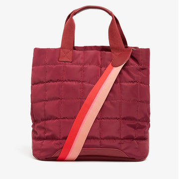 Front view of a burgundy nylon bag with a quilted design and striped strap.