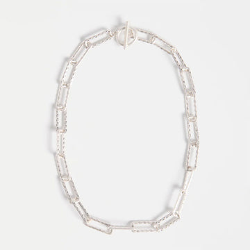 Silver chunky chain necklace on a white background.