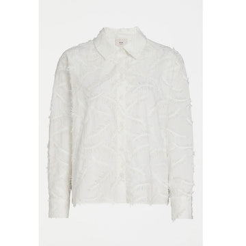 An image of a long sleeved white shirt with feather embroidery. 