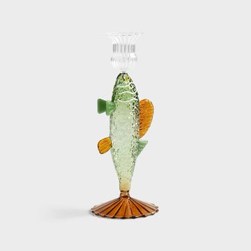 Glass fish candle holder with a white background.