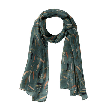 A silk scarf printed with leaves in shades of brown on a dark green background.