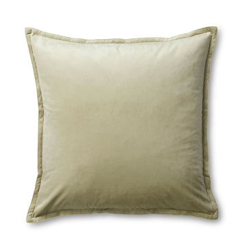 A velvet square cushion in a light green.