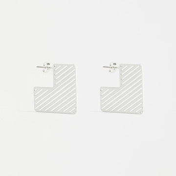 A pair of square hoop shaped earrings in white with diagonal lines.