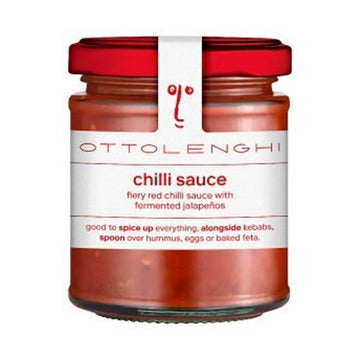 A jar filled with chilli sauce with a white label on the front with the text 'chilli sauce'.