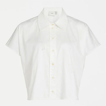 A women's white shirt with a batwing style sleeve and embellished with white beads in tassel shapes.