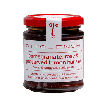 A jar filled with paste and a white label on the front with the text 'Pomegranate, rose and preserved lemon harissa'.