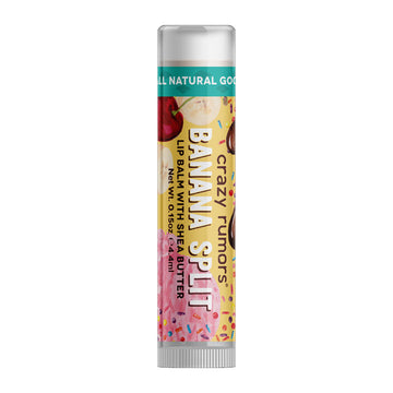 A tube of lip balm with the text 'Banana Split' on the label with illustrations of sprinkles and fruits.