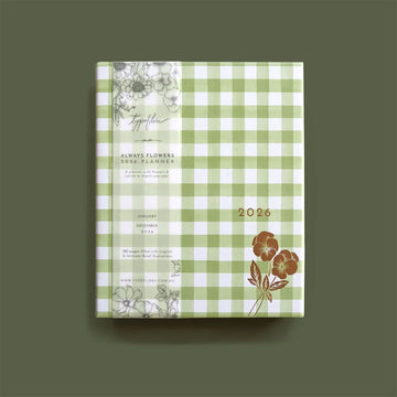 2026 planner with green checkered design and floral elements on a green background.