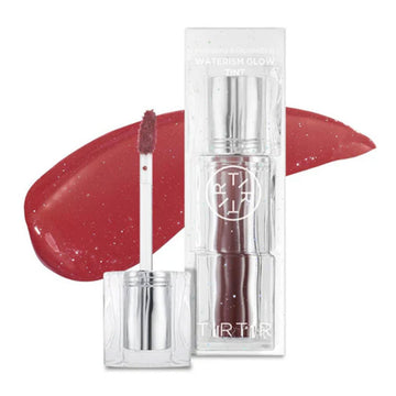 Lip tint with applicator and packaging on a white background.