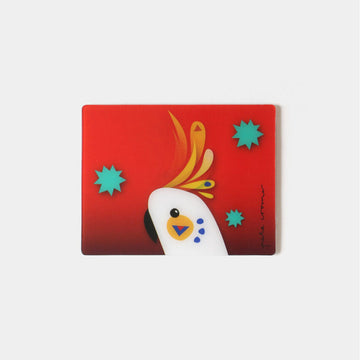 A rectangle magnet with a moving image of a cockatoo against a red background.
