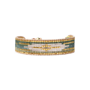 Beaded bracelet with gold, green, and white pattern on a white background.