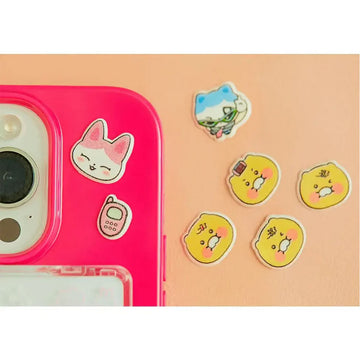 Packaged set of colorful epoxy stickers with cartoon characters on a light blue background.