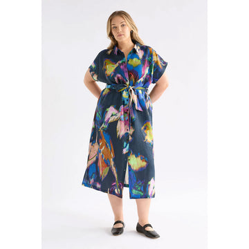 Colorful shirt dress with abstract pattern on a white background.