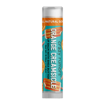 A tube of lip balm with the heading 'Orange Creamsicle' on the label with illustrations of orange popsicles. 