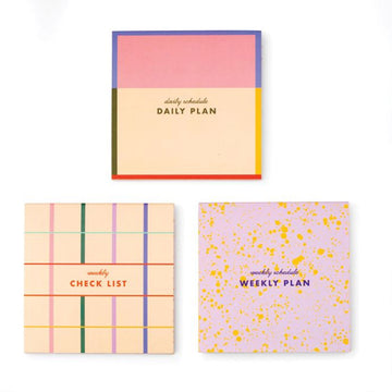 Box of Kikkerland memo pads with colorful design on a white background